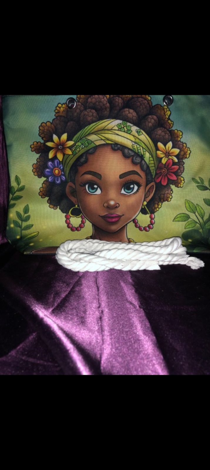 The Artistic Canvas Tote Collection ✨ — Green Background Canvas Tote with Yellow Headwrap and Blue Eyes - Features a soft green background showing a close-up portrait with striking blue eyes a patterned yellow headwrap and colorful floral hair accents